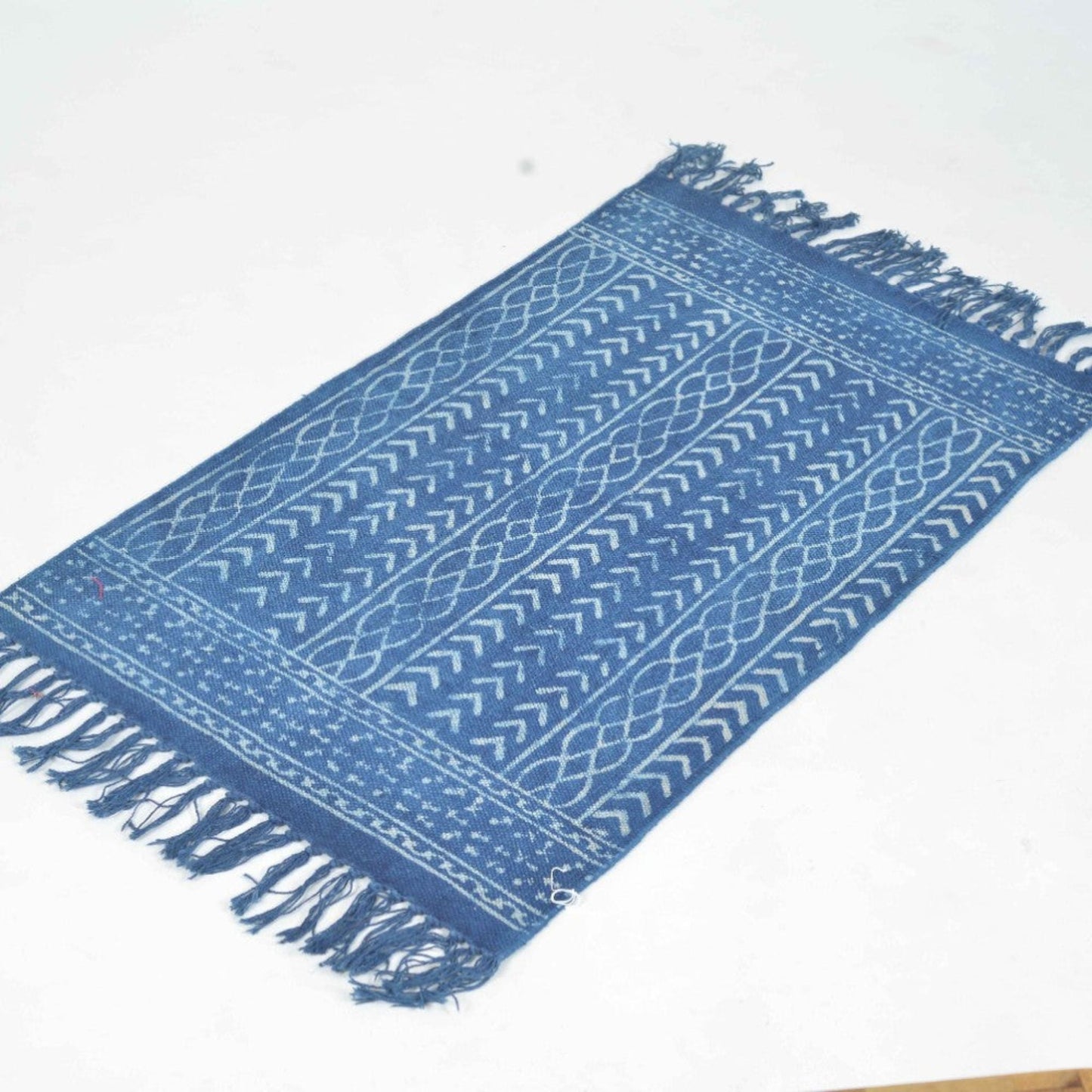 Hand Block Printed Cotton Rug in Indigo with little arrows and crossing lines on it